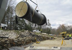 Large Pipe Being Transported Across Worksite