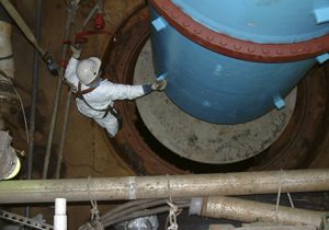 BAC worker securing new pump into place